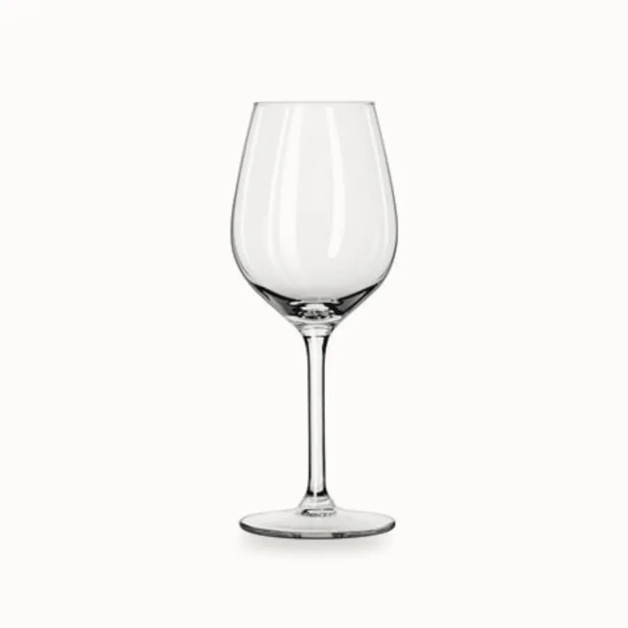 Hvitvinsglass på stett i klart glass